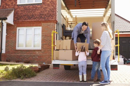 Professional house removals planning in Maidavale with moving boxes and packing supplies
