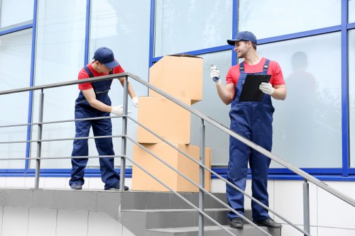 Team using safe lifting techniques and equipment