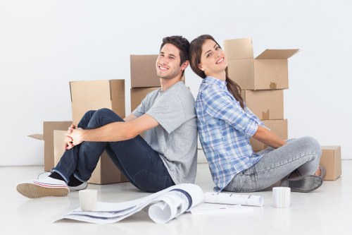 Removal team handling house moving boxes in Maidavale