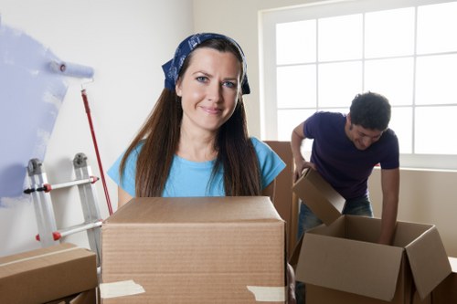 Local removal services in Maidavale loading furniture into van