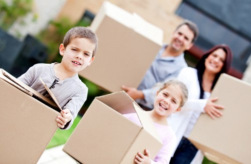 Local moving team loading furniture for a Maida Vale flat move