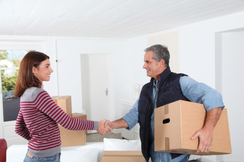 Business movers packing office furniture in Maidavale