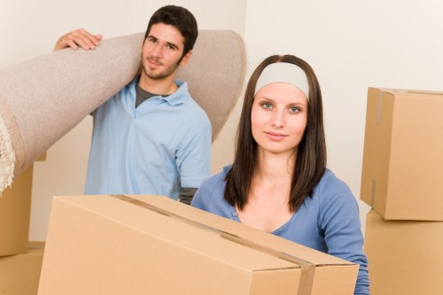 Professional movers handling furniture in a Maida Vale flat