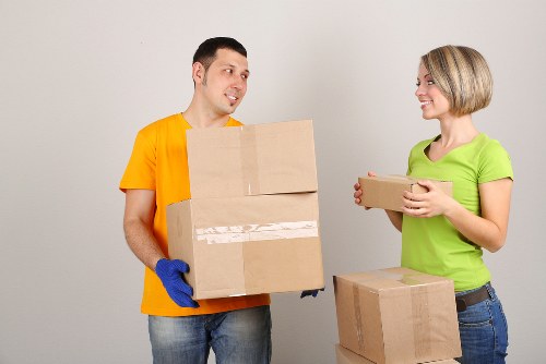 Local moving team handling boxes and household items in Maida Vale